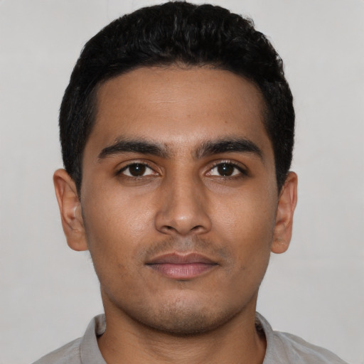 Neutral latino young-adult male with short  black hair and brown eyes