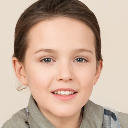 Joyful white child female with short  brown hair and brown eyes