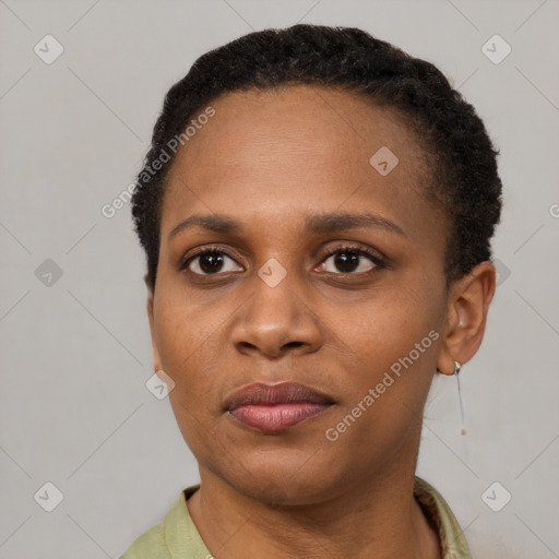 Joyful black young-adult female with short  brown hair and brown eyes