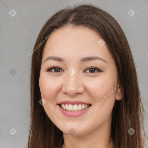 Joyful white young-adult female with long  brown hair and brown eyes