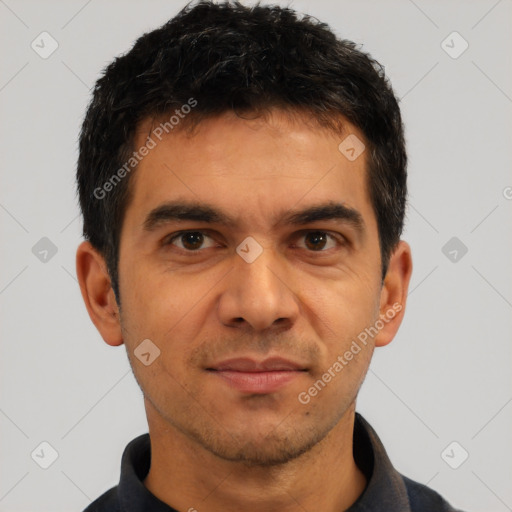 Joyful white young-adult male with short  black hair and brown eyes