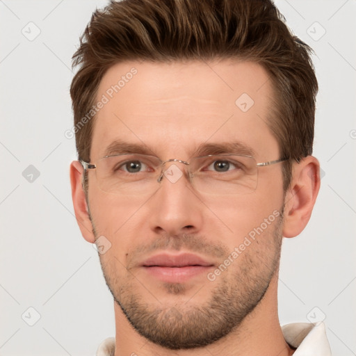 Joyful white adult male with short  brown hair and brown eyes