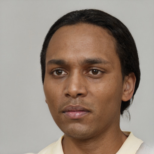 Neutral black young-adult male with short  black hair and brown eyes
