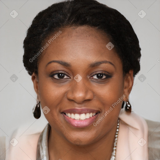 Joyful black young-adult female with short  brown hair and brown eyes