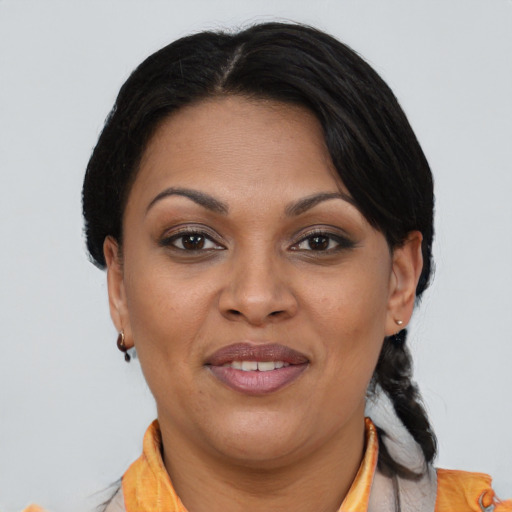 Joyful black young-adult female with medium  brown hair and brown eyes
