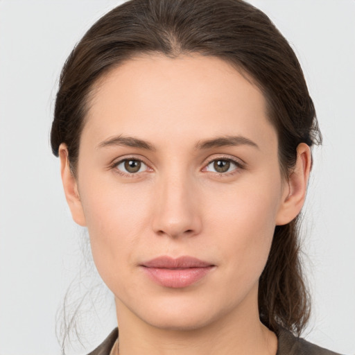 Neutral white young-adult female with medium  brown hair and brown eyes