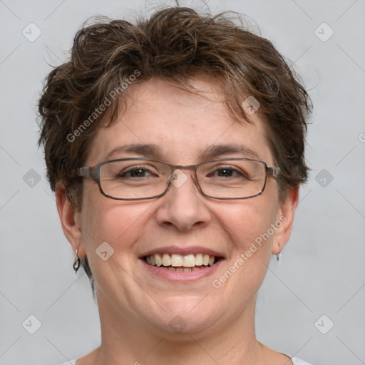 Joyful white adult female with short  brown hair and grey eyes