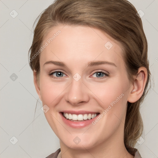 Joyful white young-adult female with medium  brown hair and blue eyes