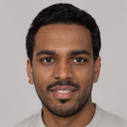 Neutral black young-adult male with short  black hair and brown eyes
