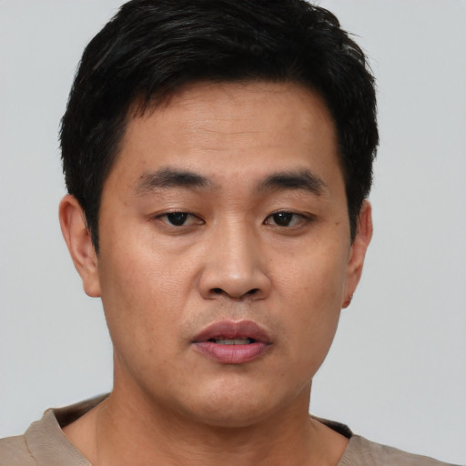 Neutral asian young-adult male with short  black hair and brown eyes