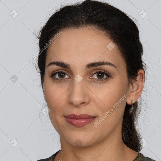 Joyful latino young-adult female with medium  brown hair and brown eyes