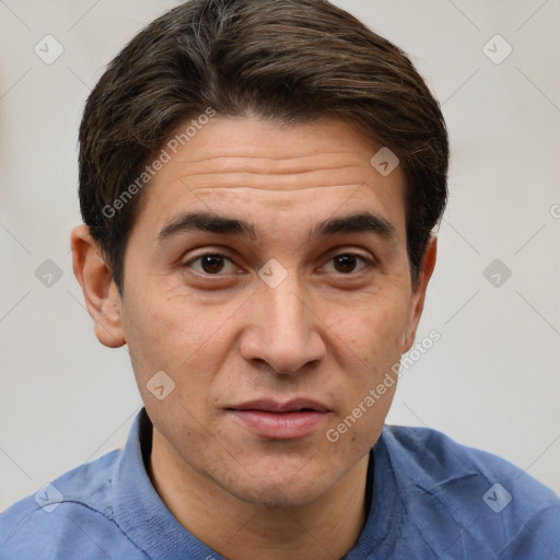 Joyful white adult male with short  brown hair and brown eyes