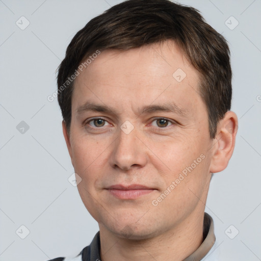 Joyful white adult male with short  brown hair and brown eyes