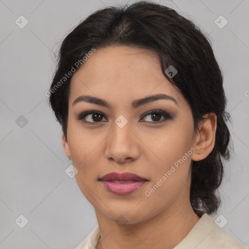 Joyful latino young-adult female with medium  brown hair and brown eyes