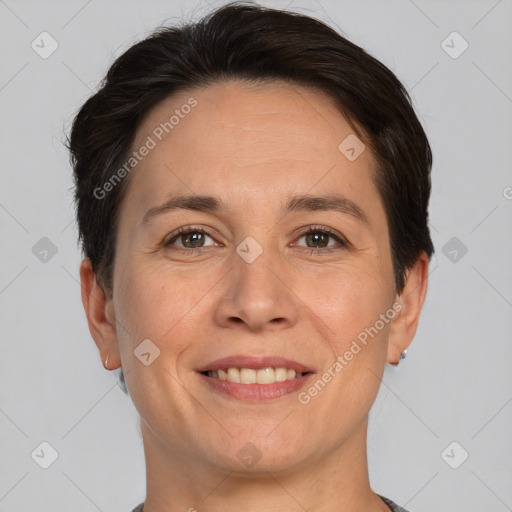 Joyful white adult female with short  brown hair and brown eyes