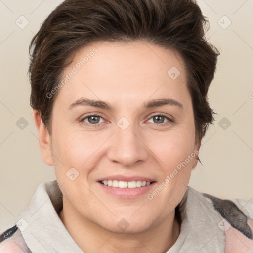 Joyful white young-adult female with short  brown hair and grey eyes