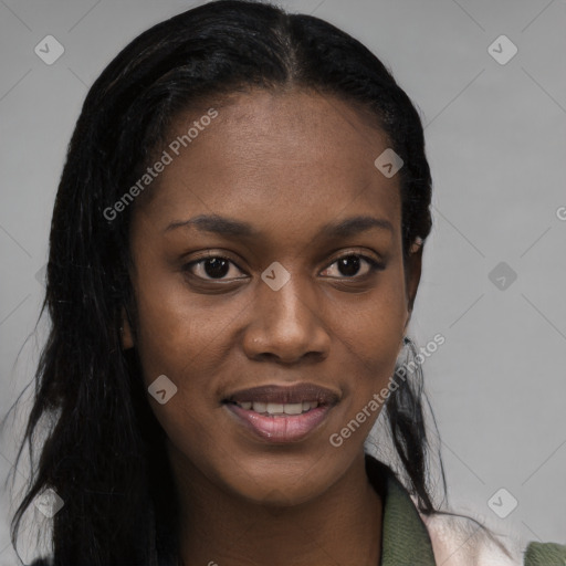 Joyful black young-adult female with long  black hair and brown eyes