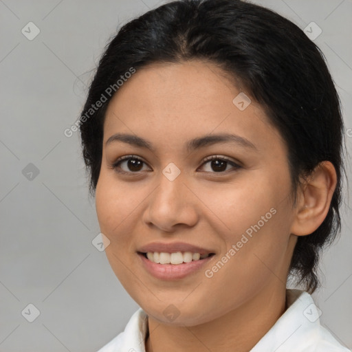 Joyful latino young-adult female with medium  brown hair and brown eyes