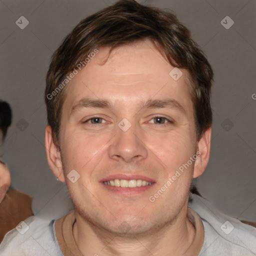 Joyful white adult male with short  brown hair and brown eyes