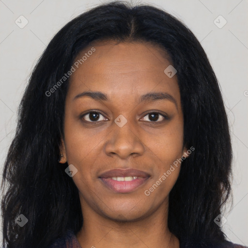 Joyful black young-adult female with long  black hair and brown eyes