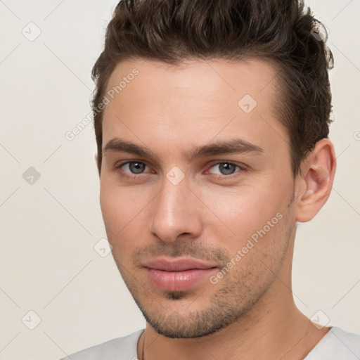 Neutral white young-adult male with short  brown hair and brown eyes