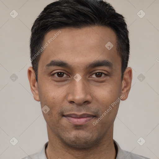 Joyful latino young-adult male with short  black hair and brown eyes