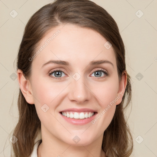 Joyful white young-adult female with medium  brown hair and blue eyes