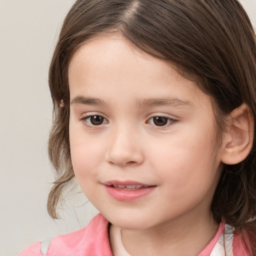 Joyful white child female with medium  brown hair and brown eyes