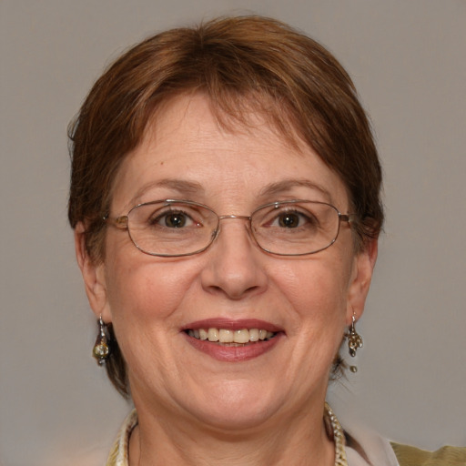 Joyful white middle-aged female with medium  brown hair and blue eyes