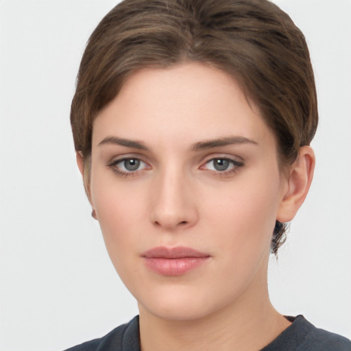 Neutral white young-adult female with short  brown hair and brown eyes