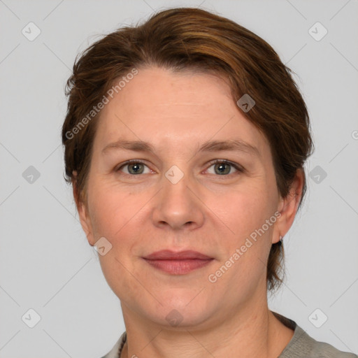 Joyful white adult female with medium  brown hair and grey eyes