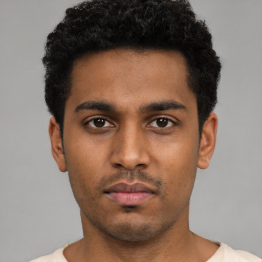 Neutral black young-adult male with short  black hair and brown eyes