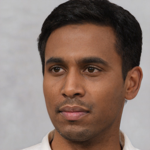 Neutral latino young-adult male with short  black hair and brown eyes