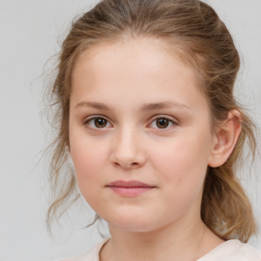 Joyful white child female with medium  brown hair and brown eyes