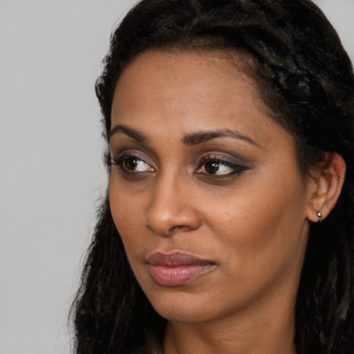 Neutral black young-adult female with long  black hair and brown eyes