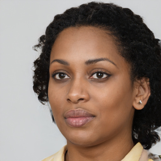 Neutral black young-adult female with medium  black hair and brown eyes