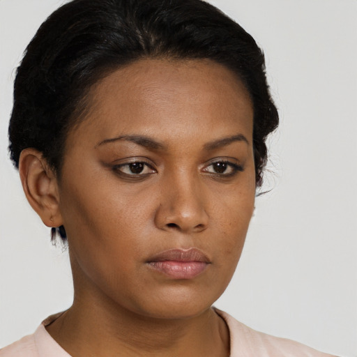 Neutral black young-adult female with short  brown hair and brown eyes