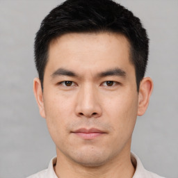 Neutral asian young-adult male with short  black hair and brown eyes