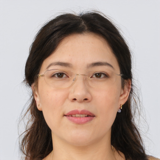 Joyful asian adult female with medium  brown hair and brown eyes