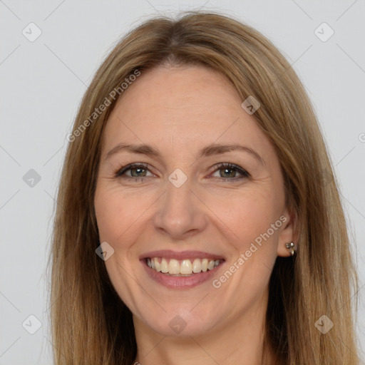 Joyful white adult female with long  brown hair and brown eyes