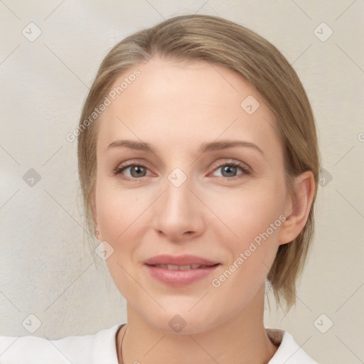 Joyful white young-adult female with medium  brown hair and blue eyes