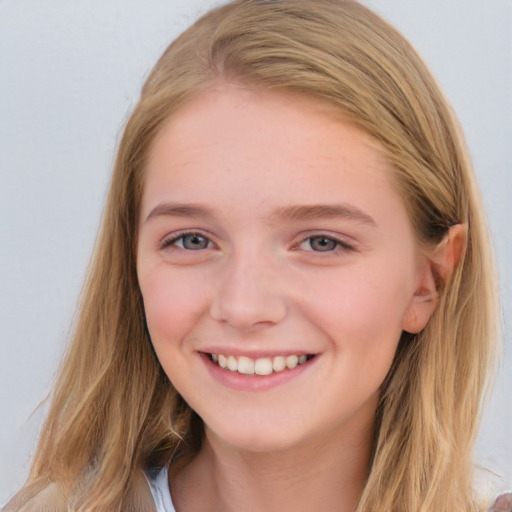 Joyful white young-adult female with long  brown hair and blue eyes