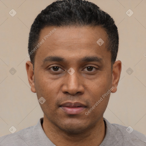 Neutral latino young-adult male with short  black hair and brown eyes