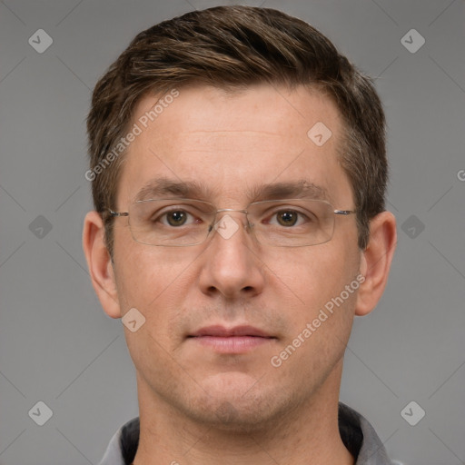 Joyful white adult male with short  brown hair and grey eyes