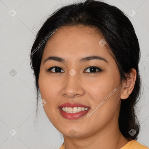 Joyful asian young-adult female with medium  black hair and brown eyes