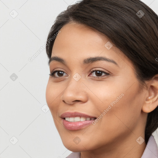 Joyful latino young-adult female with long  brown hair and brown eyes