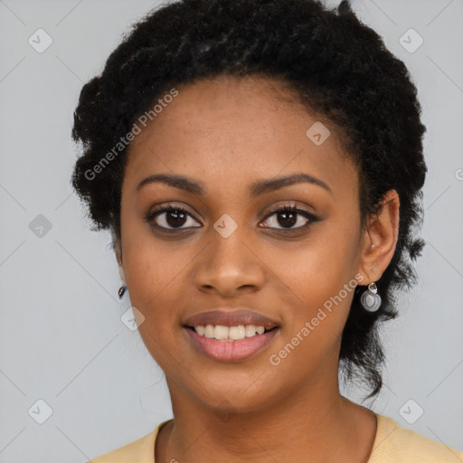 Joyful black young-adult female with long  black hair and brown eyes