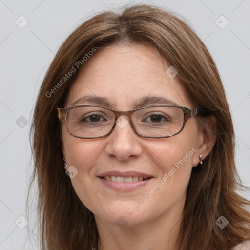 Joyful white adult female with long  brown hair and brown eyes