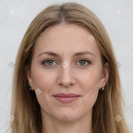 Joyful white adult female with long  brown hair and grey eyes