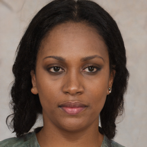 Neutral latino young-adult female with long  black hair and brown eyes